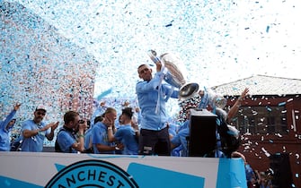 Manchester City's Phil Foden with the UEFA Champions League trophy during the Treble Parade in Manchester. Manchester City completed the treble (Champions League, Premier League and FA Cup) after a 1-0 victory over Inter Milan in Istanbul secured them Champions League glory. Picture date: Monday June 12, 2023.