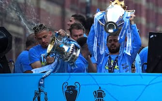 Manchester City's Bernardo Silva lifts the Premeir League trophy during the Treble Parade in Manchester. Manchester City completed the treble (Champions League, Premier League and FA Cup) after a 1-0 victory over Inter Milan in Istanbul secured them Champions League glory. Picture date: Monday June 12, 2023.