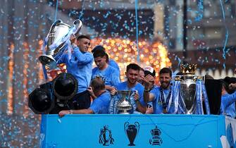 Manchester City's Phil Foden (left) with the Champions League trophy during the Treble Parade in Manchester. Manchester City completed the treble (Champions League, Premier League and FA Cup) after a 1-0 victory over Inter Milan in Istanbul secured them Champions League glory. Picture date: Monday June 12, 2023.