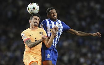 epa10279587 FC Porto's Wenderson Galeno (R) in action against Atletico Madrid's Stefan Savic (L) during the Champions League group B soccer match between FC Porto and Atletico Madrid, in Porto, Portugal, 01 November 2022.  EPA/JOSE COELHO