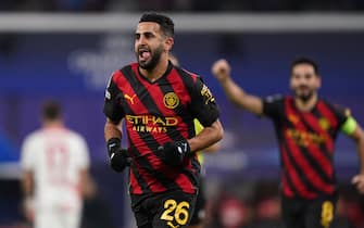 Manchester City's Riyad Mahrez celebrates scoring their side's first goal of the game during the Champions League round of 16 first leg match at the Red Bull Arena in Leipzig, Germany. Picture date: Wednesday February 22, 2023.