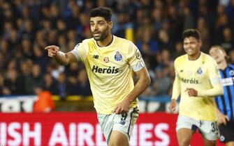 epa10267557 Mehdi Taremi of FC Porto celebrates after scoring a goal against Club Brugge during the UEFA Champions League group B match between Club Brugge and Porto in Bruges, Belgium, 26 October 2022.  EPA/STEPHANIE LECOCQ