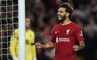 epa10223774 Mohamed Salah of Liverpool FC celebrates after scoring a goal during the UEFA Champions League group A soccer match between Liverpool FC and Rangers FC in Liverpool, Britain, 04 October 2022.  EPA/Peter Powell