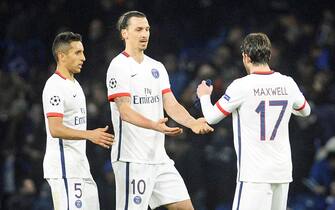 epa05203563 Paris Saint-Germain players (L-R) Marquinhos, Zlatan Ibrahimovic, and Maxwell celebrate after the UEFA Champions League Round of 16, second leg soccer match between Chelsea FC and Paris Saint-Germain at Stamford Bridge in London, Britain, 09 March 2016. PSG won 4-2 on aggregate.  EPA/GERRY PENNY