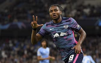 MANCHESTER, ENGLAND - SEPTEMBER 15: (BILD OUT) Christopher Nkunku of RB Leipzig celebrates after scoring his team's third goal during the UEFA Champions League group A match between Manchester City and RB Leipzig at Etihad Stadium on September 15, 2021 in Manchester, United Kingdom. (Photo by Vincent Mignott/DeFodi Images via Getty Images)