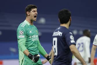 epa09927232 Real Madrid's goalkeeper Thibaut Courtois reacts during the UEFA Champions League semifinals' second leg soccer match between Real Madrid and Manchester City held at Santiago Bernabeu Stadium, in Madrid, Spain, 04 May 2022.  EPA/JUANJO MARTIN