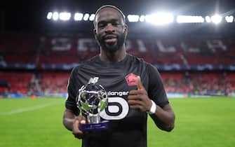 SEVILLE, SPAIN - NOVEMBER 02: Jonathan Ikone of Lille OSC poses for a photograph with the Man of the Match award following the UEFA Champions League group G match between Sevilla FC and Lille OSC at Estadio Ramon Sanchez Pizjuan on November 02, 2021 in Seville, Spain. (Photo by Fran Santiago - UEFA/UEFA via Getty Images)