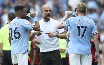 epa10118974 Manchester City manager Pep Guardiola (C) talks to his player 
Riyad Mahrez (L) and Kevin De Bruyne (R) during the English Premier League soccer match between Manchester City and AFC Bournemouth in Manchester, Britain, 13 August 2022.  EPA/PETER POWELL EDITORIAL USE ONLY. No use with unauthorized audio, video, data, fixture lists, club/league logos or 'live' services. Online in-match use limited to 120 images, no video emulation. No use in betting, games or single club/league/player publications