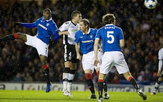 epa02403806 Maurice Edu (L) of Rangers scores the own goal during the UEFA Champions League match between Glasgow Rangers and Valencia at Ibrox Stadium Glasgow, Scotland, Britain, 20 October 2010.  EPA/BRIAN STEWART