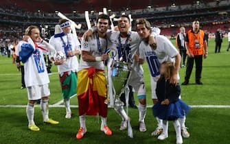 Real Madrid's Pepe, Cristiano Ronaldo and Daniel Carvajal celebrate with the trophy during the UEFA Champions League soccer final match between Real Madrid and Atletico Madrid at Estadio da Luz Stadium in Lisbon, Portugal on May 24, 2014. Pictured by David Klein/Sportimage.