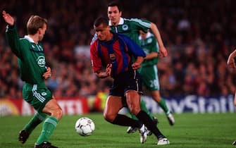 Soccer - UEFA Champions League - Quarter Final - Second Leg - Barcelona v Panathinaikos. Barcelona's Rivaldo (r) looks to take on Panathinaikos' Rene Henriksen (l)