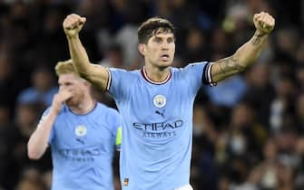 epa10184818 John Stones of Manchester City celebrates after scoring the 1-1 equalizing goal during the UEFA Champions League group G soccer match between Manchester City and Borussia Dortmund in Manchester, Britain, 14 September 2022.  EPA/PETER POWELL