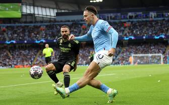 epa10634894 Jack Grealish (R) of Manchester City and Dani Carvajal of Real Madrid in action during the UEFA Champions League semi-finals, 2nd leg soccer match between Manchester City and Real Madrid in Manchester, Britain, 17 May 2023.  EPA/DAVID RAWCLIFFE