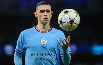 Phil Foden of Manchester City holds the Champions League ball during the UEFA Champions League match between Manchester City and Sevilla at the Etihad Stadium, Manchester, England on 2 November 2022. Photo by Ben Wright.Editorial use only, license required for commercial use. No use in betting, games or a single club/league/player publications.