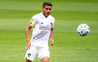 LOS ANGELES, CA - OCTOBER 25: Jonathan dos Santos #8 of Los Angeles Galaxy kicks the ball  during the match against Los Angeles FC at the Banc of California Stadium  on October 25, 2020 in Carson, California.  Los Angeles FC won the match 2-0  (Photo by Shaun Clark/Getty Images)