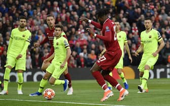 epa07554415 Divock Origi of Liverpool scores the opening goal during the UEFA Champions League semi final 2nd leg match between Liverpool FC and FC Barcelona at Anfield, Liverpool, Britain, 07 May 2019.  EPA/NEIL HALL