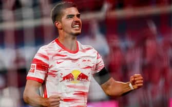 epa09422484 Leipzig's Andre Silva celebrates scoring the 4-0 lead from the penalty spot during the German Bundesliga soccer match between  RB Leipzig and VfB Stuttgart in Leipzig, Germany, 20 August 2021.  EPA/FILIP SINGER CONDITIONS - ATTENTION: The DFL regulations prohibit any use of photographs as image sequences and/or quasi-video.