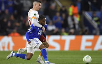 Roma's Italian defender Gianluca Mancini (L) vies with Leicester City's English midfielder Ademola Lookman during the UEFA Conference League semi-final first leg football match between Leicester City and Roma at King Power Stadium, in Leicester, on April 28, 2022. (Photo by Oli SCARFF / AFP) (Photo by OLI SCARFF/AFP via Getty Images)