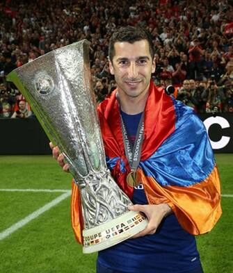 STOCKHOLM, SWEDEN - MAY 24:  Henrikh Mkhitaryan of Manchester United celebrates with the Europa League trophy after the UEFA Europa League Final match between Manchester United and Ajax at Friends Arena on May 24, 2017 in Stockholm, Sweden.  (Photo by John Peters/Manchester United via Getty Images)