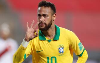 epa08742706 Neymar Jr of Brazil celebrates after scoring against Peru during the Qatar 2022 World Cup South American qualifiers match between Peru and Brazil at the National stadium in Lima, Peru, 13 October 2020.  EPA/Paolo Aguilar / POOL