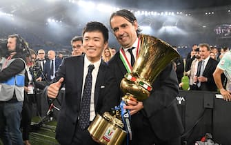 Inter s President Steven Zhang (L) and coach Simone Inzaghi celebrate with the trophy after winning the Coppa Italia Final soccer match against ACF Fiorentina at the Olimpico stadium in Rome, Italy, 24 May 2023. 
ANSA/CLAUDIO PERI