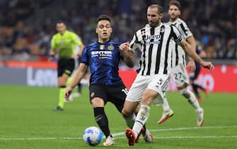 Giorgio Chiellini of Juventus FC fights for the ball against Lautaro Martinez of FC Internazionale during the Serie A 2021/22 football match between FC Internazionale and Juventus FC at Giuseppe Meazza Stadium, Milan, Italy on October 24, 2021
