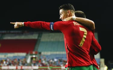 epa09515712 Portugal's player Cristiano Ronaldo celebrates a goal during the international friendly soccer match Portugal vs Qatar at Algarve held at Algarve stadium in Faro, Portugal, 09 October 2021. Portugal will face Luxembourg for the FIFA World Cup Qatar 2022 qualifying Group A soccer match next 12 October. EPA/ANTONIO COTRIM
