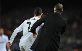 BARCELONA, SPAIN - NOVEMBER 29:  Cristiano Ronaldo (L) of Real Madrid pushes head coach Josep Guardiola of Barcelona during the la liga match between Barcelona and Real Madrid at the Camp Nou stadium on November 29, 2010 in Barcelona, Spain.  (Photo by Jasper Juinen/Getty Images)