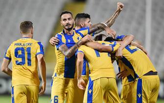 APOEL Nicosia's Serbian forward Andrija Pavlovic celebrates with his teammates after scoring a goal during the UEFA Europa league Group A football match between Cyprus' APOEL FC and Luxembourg's F91 Dudelange at the GSP stadium in Nicosia on September 19, 2019. (Photo by Sakis SAVVIDES / AFP)        (Photo credit should read SAKIS SAVVIDES/AFP via Getty Images)