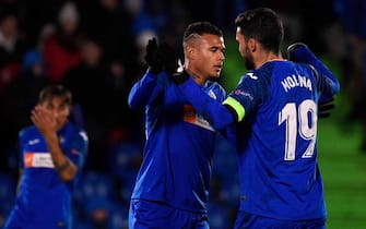 Getafe's Portuguese midfielder Kenedy (L) celebrates his goal with Getafe's Spanish forward Jorge Molina during the UEFA Europa League Group C football match between Getafe CF and FC Krasnodar at the Coliseum Alfonso Perez stadium in Getafe, on December 12, 2019. (Photo by PIERRE-PHILIPPE MARCOU / AFP) (Photo by PIERRE-PHILIPPE MARCOU/AFP via Getty Images)