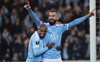 Malmo FF's Swedish midfielder Guillermo Molins (R) celebrates with Malmo FF's Comorian midfielder Fouad Bachirou after scoring during the UEFA Europa League group B football match between Malmo FF and FC Lugano at Malmo Stadium on October 24, 2019. (Photo by Andreas HILLERGREN / TT News Agency / AFP) / Sweden OUT (Photo by ANDREAS HILLERGREN/TT News Agency/AFP via Getty Images)