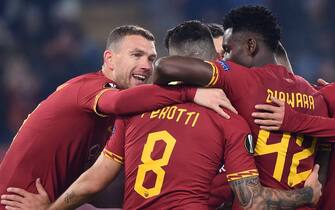 AS Roma's Bosnian forward Edin Dzeko (L) celebrates with teammates after scoring during the UEFA Europa League Group J football match AS Roma vs Wolfsberg on December 12, 2019 at the Olympic stadium in Rome. (Photo by Filippo MONTEFORTE / AFP) (Photo by FILIPPO MONTEFORTE/AFP via Getty Images)