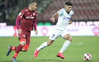 1198176937 CLUJ-NAPOCA, ROMANIA - FEBRUARY 02: FCSB's Florinel Coman and CFR Cluj's Paulo Vinicius during the Liga I match between CFR Cluj and FCSB at Dr.-Constantin-Radulescu-Stadium on February 2, 2020 in Cluj-Napoca, Romania. (Photo by MB Media/Getty Images).