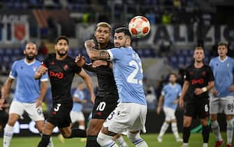 Lokomotiv Moscow's Tino Anjorin (L) in action against LazioÕs Elseid Hysaj (R) during the Europa League soccer match in Group E between SS Lazio and FK Lokomotiv Moscow at the Olimpico stadium in Rome, Italy, 30 September 2021. ANSA/RICCARDO ANTIMIANI