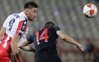 epa09564640 Red Star's Milan Pavkov (L) in action against Midtjylland's Henrik Dalsgaard (R) during the UEFA Europa League group F soccer match between Red Star and FC Midtjylland in Belgrade, Serbia, 04 November 2021.  EPA/ANDREJ CUKIC