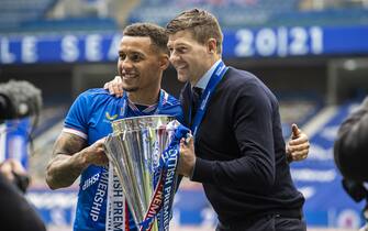GLASGOW, SCOTLAND - MAY 15: Rangers' James Tavernier lifts the Premiership trophy (left) with manager Steven Gerrard during the Scottish Premiership match  between Rangers and Aberdeen  at Ibrox Stadium, on May 15, 2021, in Glasgow, Scotland. (Photo by Craig Williamson/SNS Group via Getty Images)