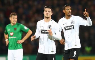 Frankfurt's Sebastien Haller (R) celebrating with teammate Luka Jovic (C) after scoring the opening goal during the DFB Cup soccer match between Schweinfurt 05 and Eintracht Frankfurt in the Willy Sachs Stadium in Schweinfurt, Germany, 24 October 2017.

(EMBARGO CONDITIONS - ATTENTION: The DFB prohibits the utilisation and publication of sequential pictures on the internet and other online media during the match (including half-time). ATTENTION: BLOCKING PERIOD! The DFB permits the further utilisation and publication of the pictures for mobile services (especially MMS) and for DVB-H and DMB only after the end of the match.) Photo: Daniel Karmann/dpa (Photo by Daniel Karmann/picture alliance via Getty Images)