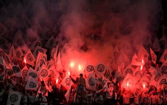 Eintracht Frankfurt supporters hold flares during the UEFA Europa League final football match between Eintracht Frankfurt and Glasgow Rangers at the Ramon Sanchez Pizjuan stadium in Seville on May 18, 2022. (Photo by JORGE GUERRERO / AFP) (Photo by JORGE GUERRERO/AFP via Getty Images)