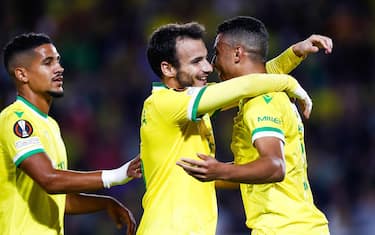 epa10171534 FC Nantes' Mostafa Mohamed (R) celebrates with teammates after scoring the 1-0 goal during the UEFA Europa League group G soccer match between FC Nantes and Olympiakos FC, at the Stade de la Beaujoire in Nantes, France, 08 September 2022.  EPA/Mohammed Badra