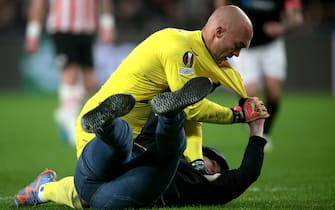 EINDHOVEN - A supporter fights with Sevilla FC goalkeeper Marko Dmitrovic during the UEFA Europa league play-off match between PSV Eindhoven and Sevilla FC at Phillips stadium on February 23, 2023 in Eindhoven, Netherlands. AP | Dutch Height | Jeroen Putmans /ANP/Sipa USA