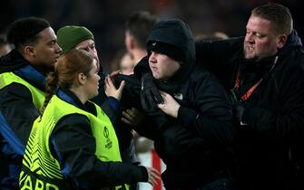 EINDHOVEN - A supporter is taken off the pitch during the UEFA Europa league play-off match between PSV Eindhoven and Sevilla FC at Phillips stadium on February 23, 2023 in Eindhoven, Netherlands. AP | Dutch Height | Jeroen Putmans /ANP/Sipa USA