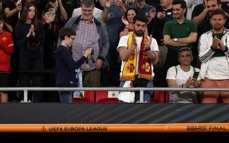 BUDAPEST, HUNGARY - MAY 31: A young fan in the crowd marvels at the runners' up medal thrown to him by Jose Mourinho Head coach of AS Roma following the UEFA Europa League 2022/23 final match between Sevilla FC and AS Roma at Puskas Arena on May 31, 2023 in Budapest, Hungary. (Photo by Jonathan Moscrop/Getty Images)