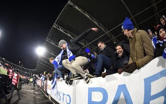 Finnish fans invade the pitch as they celebrate the victory after the UEFA Euro 2020 Group J qualification football match between Finland and Liechtenstein in Helsinki, Finland, on November 15, 2019. - Finland has qualified for the first time for a major football tournament. (Photo by Martti Kainulainen / Lehtikuva / AFP) / Finland OUT (Photo by MARTTI KAINULAINEN/Lehtikuva/AFP via Getty Images)