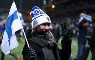 HELSINKI, FINLAND - NOVEMBER 15: A Finland fan celebrates at full time of the UEFA Euro 2020 Qualifier between Finland and Liechtenstein on November 15, 2019 in Helsinki, Finland. (Photo by James Williamson - AMA/Getty Images)