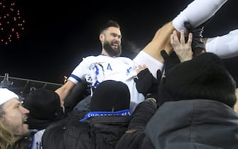 Finnish captain Tim Sparv celebrates with fans after the UEFA Euro 2020 Group J qualification football match between Finland and Liechtenstein in Helsinki, Finland, on November 15, 2019. - Finland has qualified for the first time for a major football tournament. (Photo by Markku Ulander / Lehtikuva / AFP) / Finland OUT (Photo by MARKKU ULANDER/Lehtikuva/AFP via Getty Images)