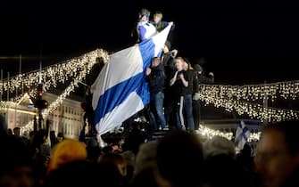 Finnish fans celebrate victory at a fountain in central Helsinki after the UEFA Euro 2020 Group J qualification football match between Finland and Liechtenstein in Helsinki, Finland, on November 15, 2019. - Finland has qualified for the first time for a major football tournament. (Photo by Mikko Stig / Lehtikuva / AFP) / Finland OUT (Photo by MIKKO STIG/Lehtikuva/AFP via Getty Images)