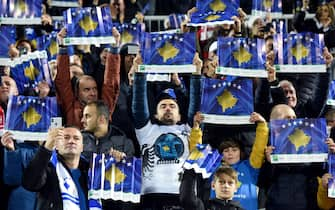 Fans hold up posters with the Kosovo flag before the UEFA Euro 2020 Group A football qualification match between Kosovo and England at the Fadil Vokrri stadium in Prishtina on November 17, 2019. (Photo by Robert ATANASOVSKI / AFP) (Photo by ROBERT ATANASOVSKI/AFP via Getty Images)