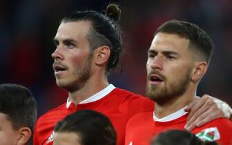 Wales' striker Gareth Bale (L) and Wales' midfielder Aaron Ramsey (R) sing the National Anthem ahead of the UEFA Nations League football match between Wales and Republic of Ireland at Cardiff City Stadium in Cardiff on September 6, 2018. (Photo by Geoff CADDICK / AFP)        (Photo credit should read GEOFF CADDICK/AFP via Getty Images)