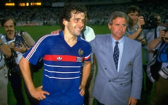943864 27 Jun 1984: Michel Platini of France with coach Michel Hidalgo after victory in the European Championship Final against Spain at Parc des Princes in Paris. France won the match 2-0. \ Mandatory Credit: David Cannon /Allsport