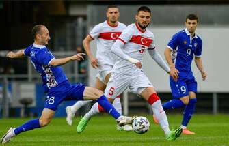 Moldova's midfielder Gheorghe Anton (L) and Turkey's midfielder Okay Yokuslu vie for the ball during the friendly football match Turkey vs Moldova in Paderborn, western Germany on June 3, 2021, in preparation for the UEFA European Championships. (Photo by SASCHA SCHUERMANN / AFP) (Photo by SASCHA SCHUERMANN/AFP via Getty Images)